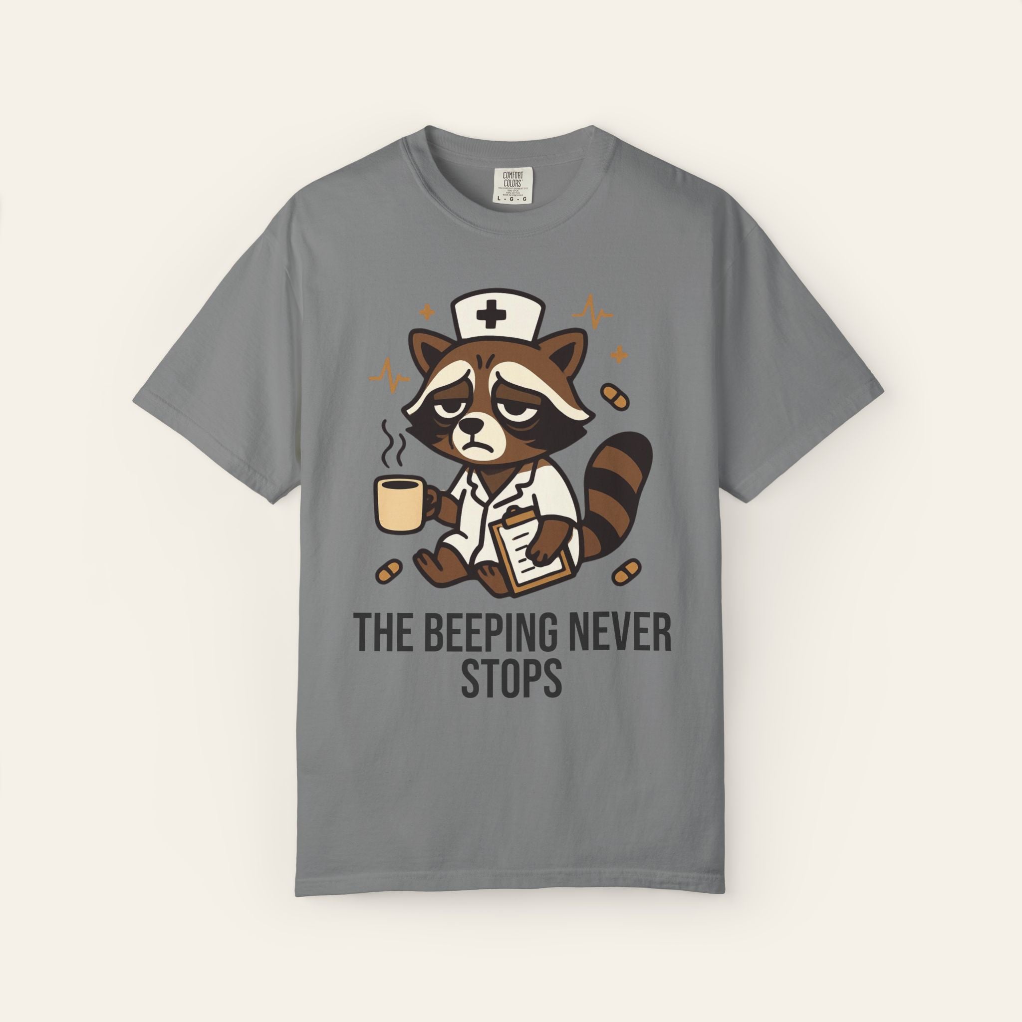 The Beeping Never Stops — Premium Garment-Dyed Nurse T-Shirt | New Chapter Tees